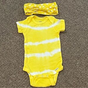12 months one piece with matching headband tie dye polka dots. Yellow and white
